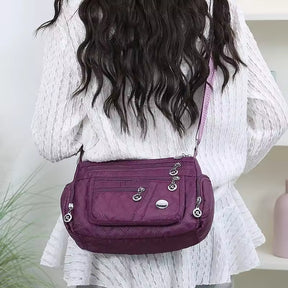 bolsa tiracolo roxa matelassê feminina modelo