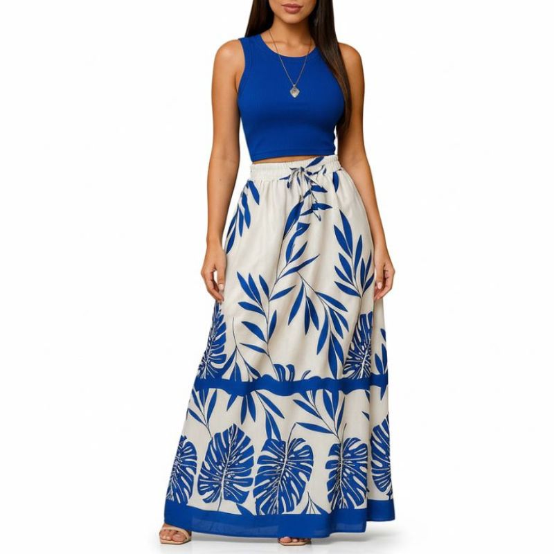 alt="Saia feminina longa estampada azul com folhagem ideal para praia e passeios"